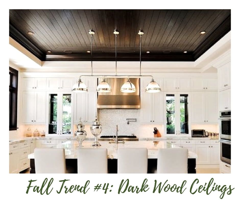 Kitchen With Dark Wood Ceiling and Gold Hood