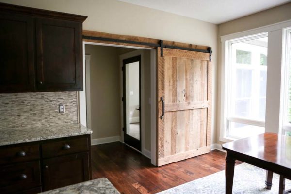 Reclaimed Sliding Barn Door Two Panel Door Dark Cabinets